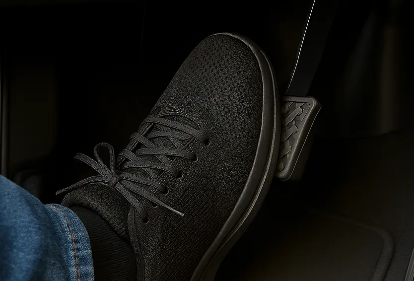 Foot pressing car brake pedal