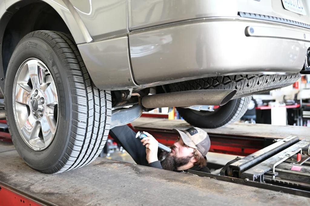Mechanic working under a vehicle.