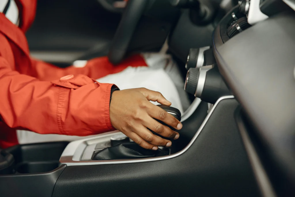 Hand adjusting car gear shift