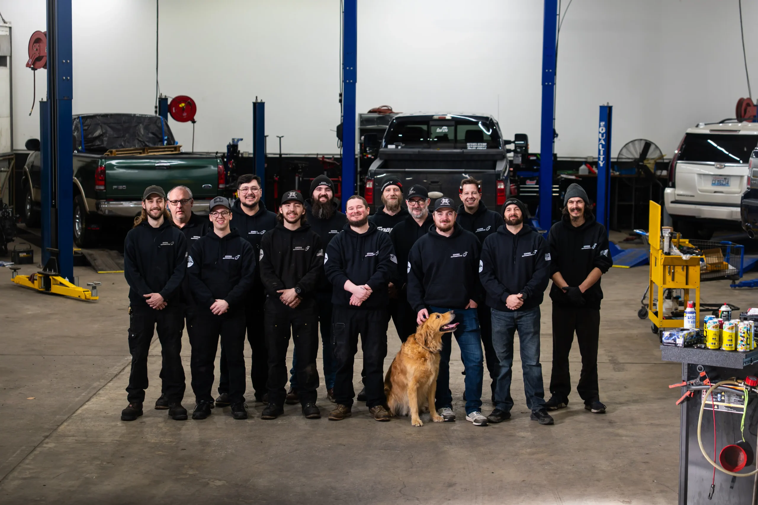 Group of mechanics with a dog